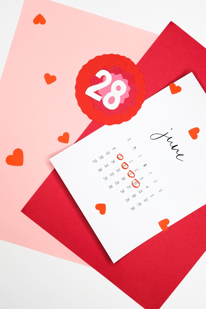 A vibrant calendar with heart shapes highlighting a date, ideal for event planning concepts.